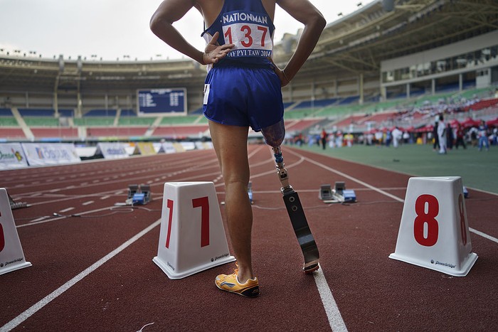 NAY PYI TAW, BURMA - JANUARY 15: An athelete gets ready to compete in the mens 100m sprint event during the 7th ASEAN Para games held at the Wunna Theikdi Sports Complex on January 15, 2014 in Nay Pyi Taw, Burma.(Photo by Ruben Salgado Escudero/Getty Images)