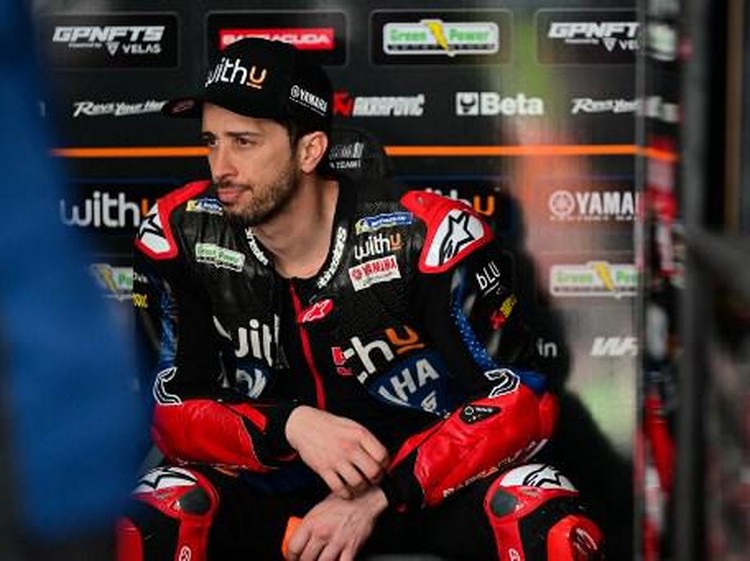 WithU Yamaha RNF MotoGP Teams Italian rider Andrea Dovizioso sits in the pit on the first day of the pre-season MotoGP winter test at the Sepang International Circuit in Sepang on February 5, 2022. (Photo by Ahmad Fadali / AFP)