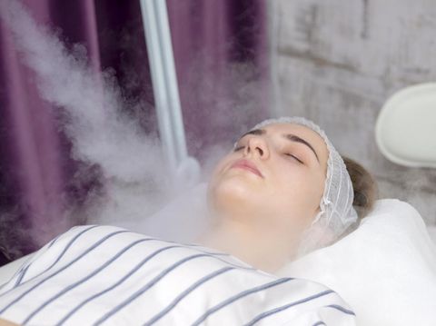 Beauty treatment of young female face, ozone facial steamer