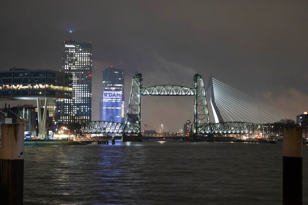 View of the Koningshaven Bridge, known as De Hef, (The Lift), in Rotterdam, Netherlands, Thursday, Feb. 3, 2022. A plan to dismantle the historic bridge in the heart of Dutch port city so that a huge yacht, reportedly being built for Amazon founder Jeff Bezos, can get to the North Sea is unlikely to be plain sailing. Reports this week that the city had already agreed to take apart the recently restored bridge sparked anger in the city, with one Facebook group set up calling for people to pelt the multimillion dollar yacht with rotten eggs. (AP Photo/Peter Dejong)