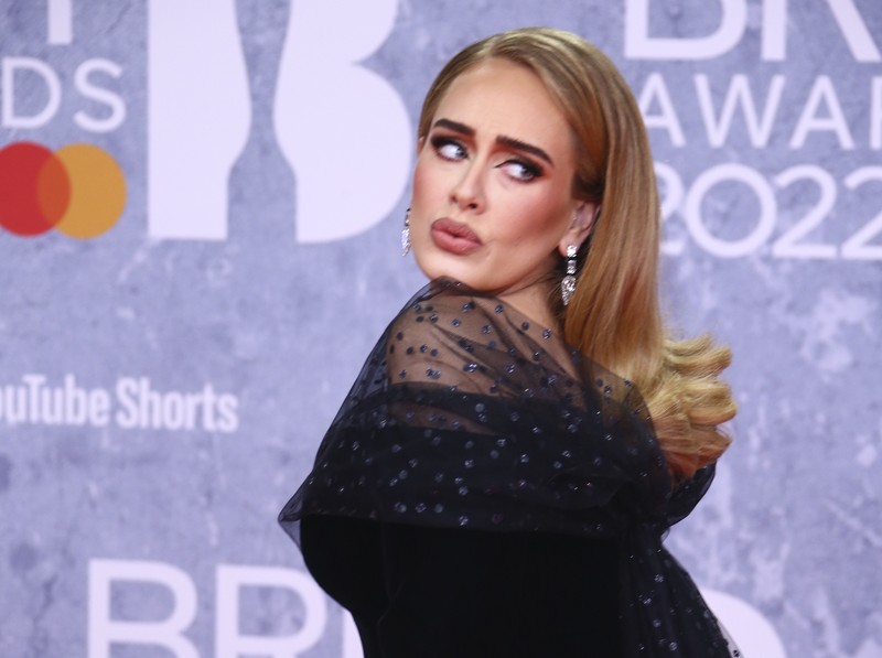Adele poses for photographers upon arrival at the Brit Awards 2022 in London Tuesday, Feb. 8, 2022. (Photo by Joel C Ryan/Invision/AP)