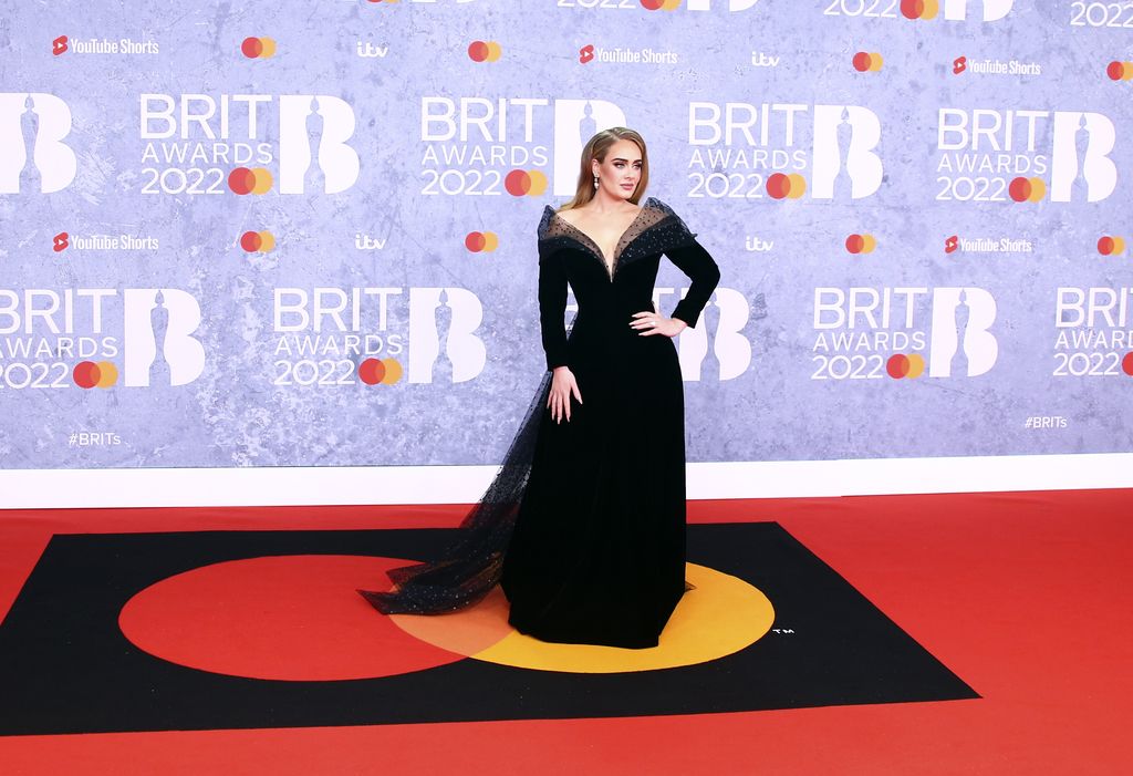Adele poses for photographers upon arrival at the Brit Awards 2022 in London Tuesday, Feb. 8, 2022. (Photo by Joel C Ryan/Invision/AP)