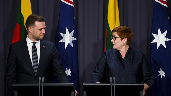 Australian Foreign Affairs Minister Marise Payne, right, and Lithuanias counterpart Gabrielius Landsbergis hold a press conference at Parliament House in Canberra, Australia, Wednesday, Feb. 9, 2022. The foreign ministers called on like-minded countries to join forces against Chinese economic coercion. (Lukas Coch/AAP Image via AP)