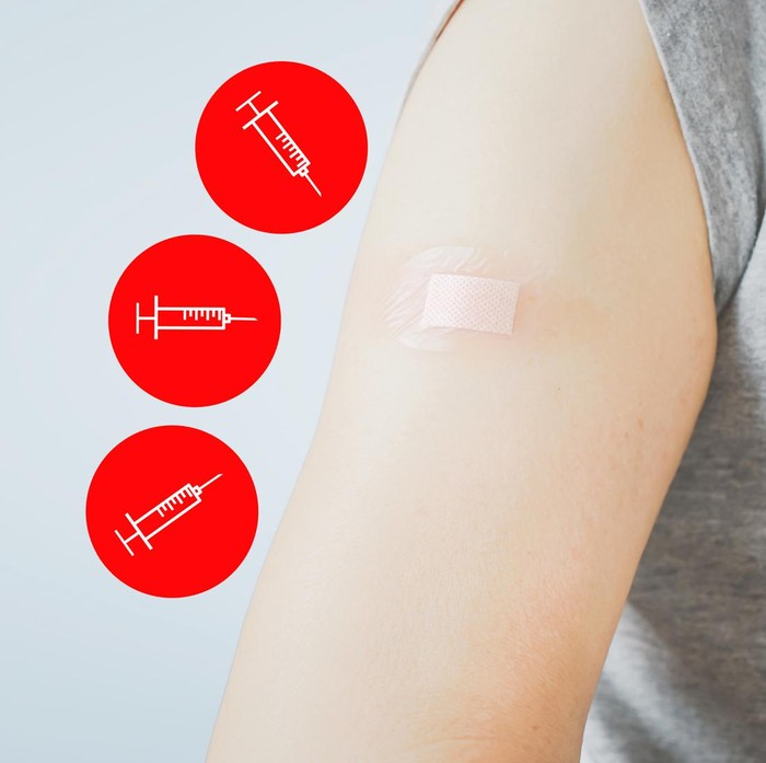 senior woman showing  her arm with bandage after got vaccinated or inoculation three dose or booster dose due to spread of corona virus, population, social or herd immunity concept
