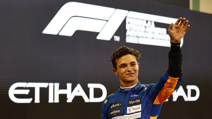 ABU DHABI, UNITED ARAB EMIRATES - DECEMBER 11: Third place qualifier Lando Norris of Great Britain and McLaren F1 celebrates in parc ferme during qualifying ahead of the F1 Grand Prix of Abu Dhabi at Yas Marina Circuit on December 11, 2021 in Abu Dhabi, United Arab Emirates. (Photo by Mark Thompson/Getty Images)