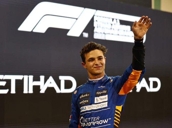ABU DHABI, UNITED ARAB EMIRATES - DECEMBER 11: Third place qualifier Lando Norris of Great Britain and McLaren F1 celebrates in parc ferme during qualifying ahead of the F1 Grand Prix of Abu Dhabi at Yas Marina Circuit on December 11, 2021 in Abu Dhabi, United Arab Emirates. (Photo by Mark Thompson/Getty Images)