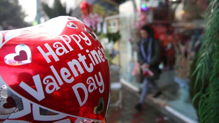 A Valentines Day balloon hangs outside a flower shop ahead of Valentines Day, in Kabul, Afghanistan, Thursday, Feb. 13, 2020. (AP Photo/Rahmat Gul)