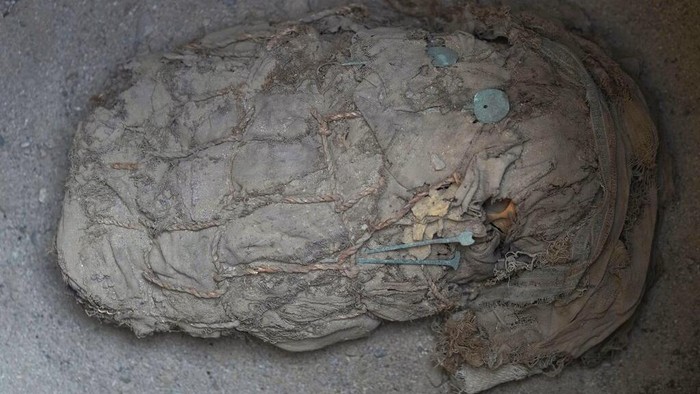 A mummy is seen at a site where archaeologist found six child mummies in Cajamarquilla, near Lima, Peru, Sunday, Feb. 13, 2022. According to archeologists the mummies are from 800-1200 AD. (AP Photo/Martin Mejia)