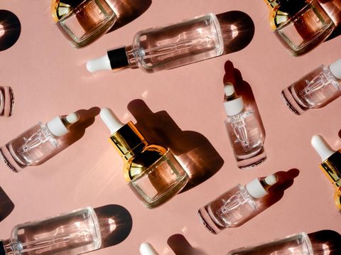 Glass Bottle with fluid collagen and hyaluronic acid, hydration skin. Top flatlay view copyspace. Natural background