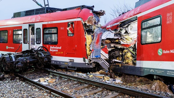 ACCIDENTS-RAILROAD-TRAFFIC-BAVARIA-GERMANY A cameraman films at the scene of the accident. One person was killed and more than ten injured in a collision between two commuter trains in the Munich district on Monday. There was a low double-digit number of injured, reported a spokesman for the Munich police headquarters.
