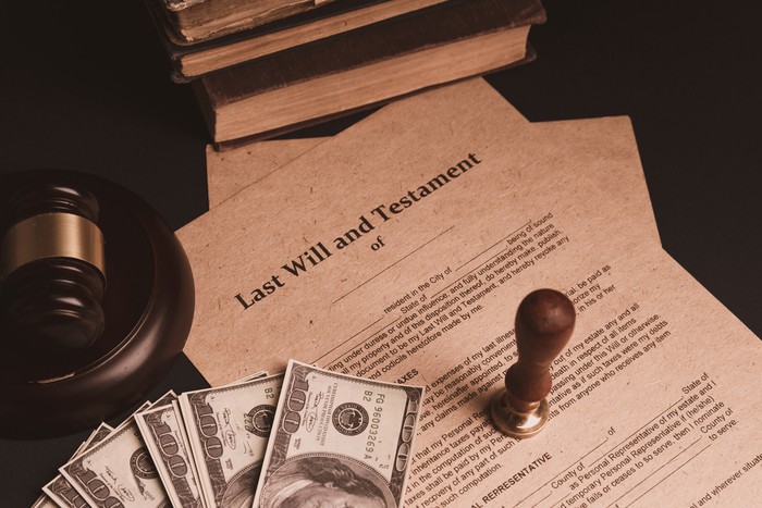 Notarys public pen and stamp on testament and last will. Notary public tools