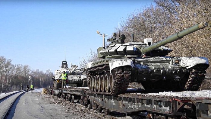 In this photo taken from video provided by the Russian Defense Ministry Press Service on Tuesday, Feb. 15, 2022, a Russian tank is loaded onto railway platforms after the end of military drills in South Russia. In what could be another sign that the Kremlin would like to lower the temperature, Russias Defense Ministry announced Tuesday that some units participating in military exercises would begin returning to their bases. (Russian Defense Ministry Press Service via AP)