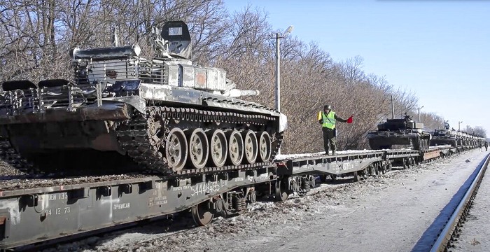 In this photo taken from video provided by the Russian Defense Ministry Press Service on Tuesday, Feb. 15, 2022, a Russian tank is loaded onto railway platforms after the end of military drills in South Russia. In what could be another sign that the Kremlin would like to lower the temperature, Russias Defense Ministry announced Tuesday that some units participating in military exercises would begin returning to their bases. (Russian Defense Ministry Press Service via AP)