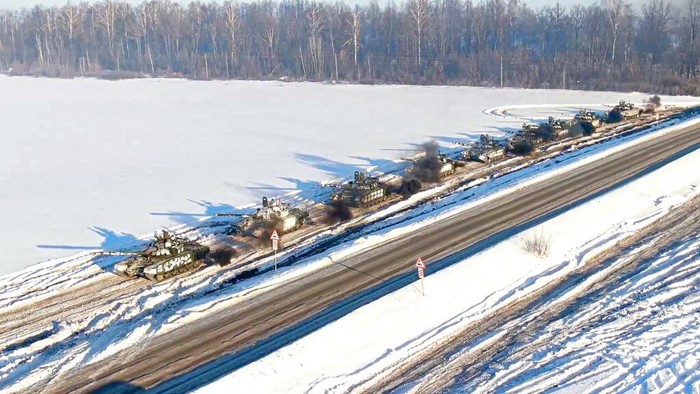 In this photo taken from video provided by the Russian Defense Ministry Press Service on Tuesday, Feb. 15, 2022, a Russian tank is loaded onto railway platforms after the end of military drills in South Russia. In what could be another sign that the Kremlin would like to lower the temperature, Russias Defense Ministry announced Tuesday that some units participating in military exercises would begin returning to their bases. (Russian Defense Ministry Press Service via AP)