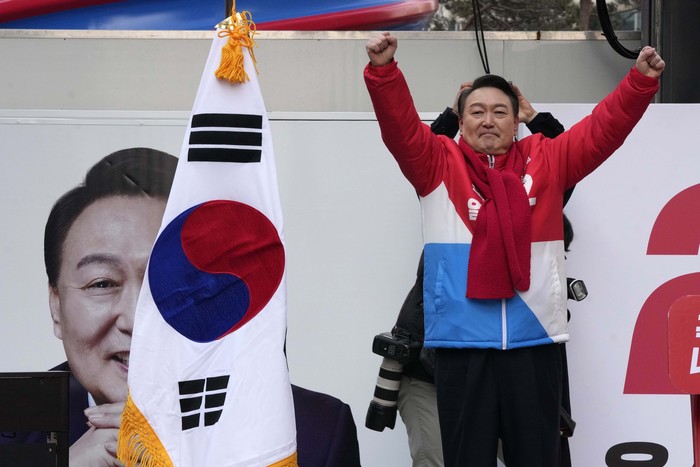 Supporters of Yoon Suk Yeol, the presidential candidate of the main opposition People Power Party, wait for his arrival during a presidential election campaign in Seoul, South Korea, Tuesday, Feb. 15, 2022. Candidates kicked off official campaign on Tuesday for South Koreas presidential election on March 9. (AP Photo/Ahn Young-joon)