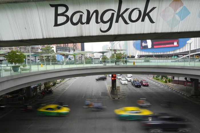 Vehicles run on the road under the 