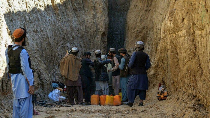 Officials said the boy slipped to the bottom of the 25-metre (80-foot) shaft, but was pulled by rope to about 10-metres before becoming stuck (Javed TANVEER/AFP)