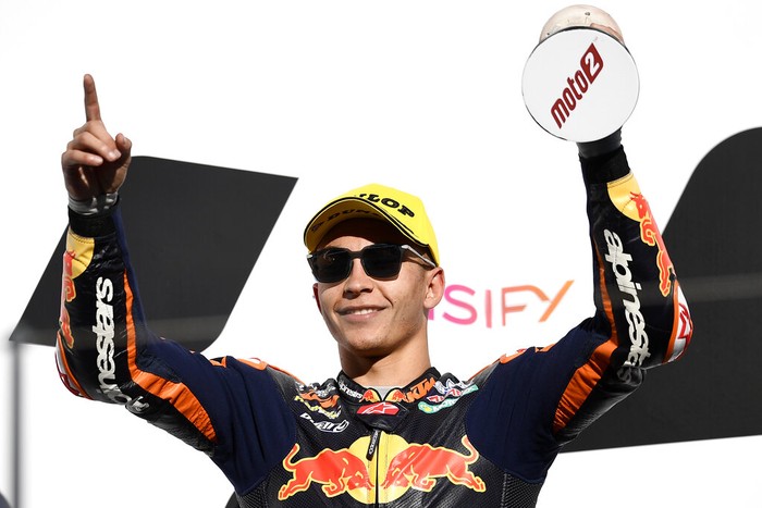 Moto2 rider Remy Gardner of Australia celebrates after winning the championship, at the end of the Valencia Motorcycle Grand Prix, the last race of the season, at the Ricardo Tormo circuit in Cheste, near Valencia, Spain, Sunday, Nov. 14, 2021. (AP Photo/Alberto Saiz)
