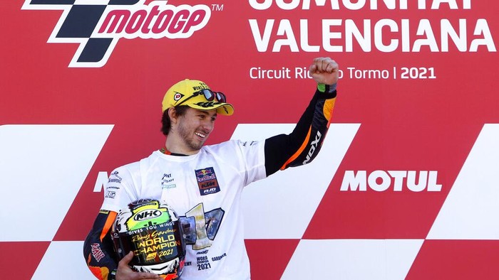 Moto2 rider Remy Gardner of Australia celebrates after winning the championship, at the end of the Valencia Motorcycle Grand Prix, the last race of the season, at the Ricardo Tormo circuit in Cheste, near Valencia, Spain, Sunday, Nov. 14, 2021. (AP Photo/Alberto Saiz)