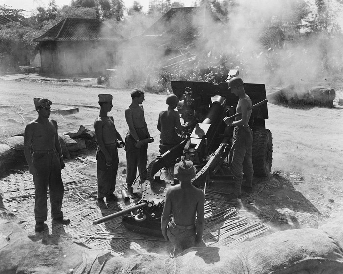 Artillerymen from the Marine Brigade fire high-explosive shells from a 25-pounder during an action in Tanjungsari, East Java, early 1947, in todays Indonesia, are seen in this handout photo provided to Reuters on February 17, 2022.  The Netherlands Institute for Military History (NIMH)/Handout via REUTERS ATTENTION EDITORS - THIS IMAGE HAS BEEN SUPPLIED BY A THIRD PARTY. MANDATORY CREDIT. NO RESALES. NO ARCHIVES.