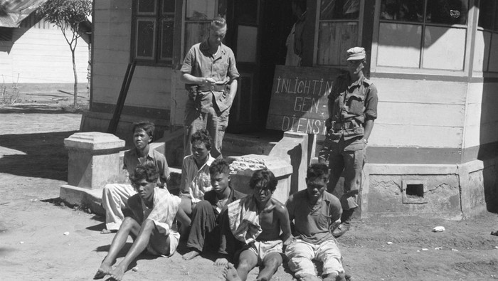 A group of Republican fighters to be interrogated by the Intelligence and Security Group in Sidikalang, Northwest Sumatra, early in 1949, in today's Indonesia, is seen in this handout photo provided to Reuters on February 17, 2022. National Archives/Handout via REUTERS ATTENTION EDITORS - THIS IMAGE HAS BEEN SUPPLIED BY A THIRD PARTY. MANDATORY CREDIT. NO RESALES. NO ARCHIVES.