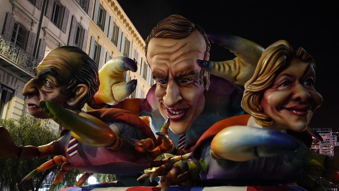 'Kandidat Presiden Prancis' Ramaikan Nice Carnival Bertema Hewan A carnival float with the heads of candidates for the French presidential election is shown during the Nice carnival in Nice, southern France, Saturday, Feb. 19, 2022. The theme of the Carnival's 149th edition in the French Riviera city of Nice is King of Animals. (AP Photo/Daniel Cole)