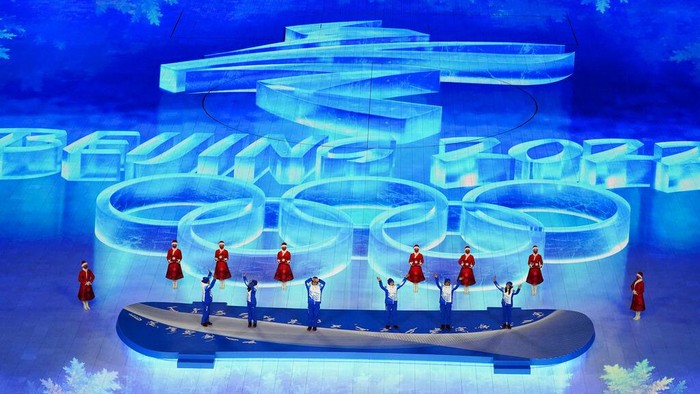 Volunteers are honored during the closing ceremony of the 2022 Winter Olympics, Sunday, Feb. 20, 2022, in Beijing. (AP Photo/Brynn Anderson)