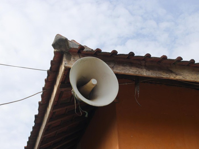 Old white speaker in the corner of an old mosque in a rural area in Indonesia