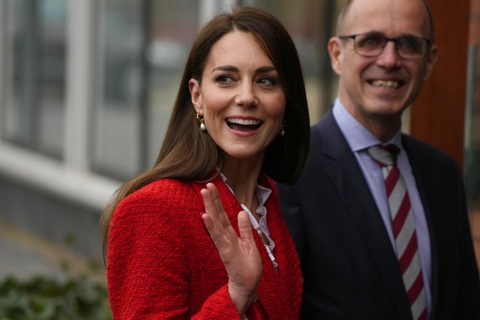 Britains Kate, Duchess of Cambridge waves as she arrives at the University of Copenhagen Tuesday, Feb. 22, 2022, in Copenhagen, Denmark, where she will learn from world-leading researchers running the CIMHP, which aims to promote mental well-being and relationships between infants and their parents. Kate, Duchess of Cambridge is in Copenhagen on a two day working visit with The Royal Foundation Centre for Early Childhood. (AP Photo/Alastair Grant)