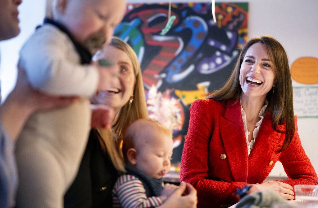 Britain's Kate, the Duchess of Cambridge,right, reacts as she speaks to parents about the program, 'Copenhagen Infant Mental Health Project' (CIMPH) 'Understanding Your Baby Project' during a visit to the Children's Museum at Frederiksberg, Copenhagen, Tuesday, Feb. 22, 2022. The Duchess is in Copenhagen on a two day working visit with The Royal Foundation Centre for Early Childhood. (Liselotte Sabroe/Ritzau Scanipix via AP)