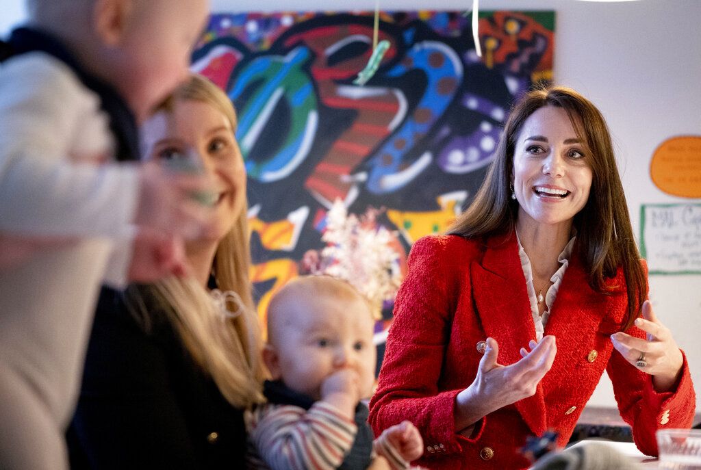 Britain's Kate, the Duchess of Cambridge,right, reacts as she speaks to parents about the program, 'Copenhagen Infant Mental Health Project' (CIMPH) 'Understanding Your Baby Project' during a visit to the Children's Museum at Frederiksberg, Copenhagen, Tuesday, Feb. 22, 2022. The Duchess is in Copenhagen on a two day working visit with The Royal Foundation Centre for Early Childhood. (Liselotte Sabroe/Ritzau Scanipix via AP)