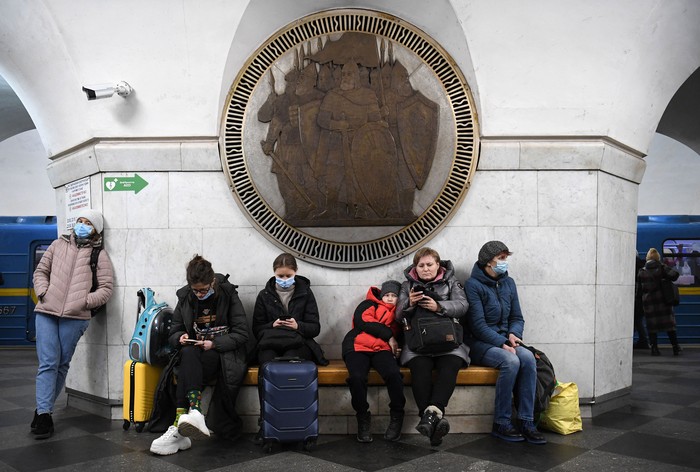 People take shelter in Vokzalna metro station in Kyiv in the morning of February 24, 2022.
Air raid sirens rang out in downtown Kyiv today as cities across Ukraine were hit with what Ukrainian officials said were Russian missile strikes and artillery. - Russian President announced a military operation in Ukraine on February 24, 2022, with explosions heard soon after across the country and its foreign minister warning a 