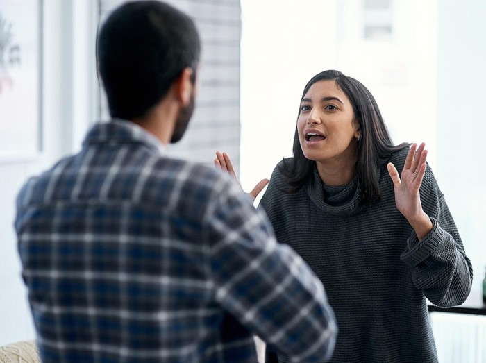ilustrasi pasangan Shot of a young couple having an argument at home