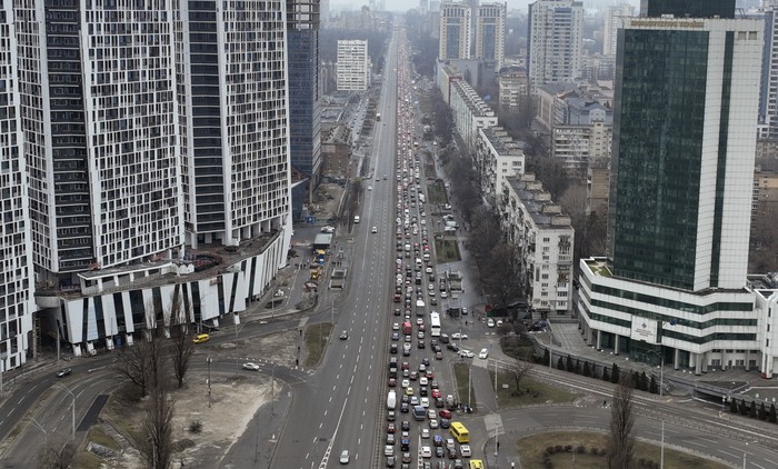 Traffic jams are seen as people leave the city of Kyiv, Ukraine, Thursday, Feb. 24, 2022. Russian President Vladimir Putin on Thursday announced a military operation in Ukraine and warned other countries that any attempt to interfere with the Russian action would lead to 