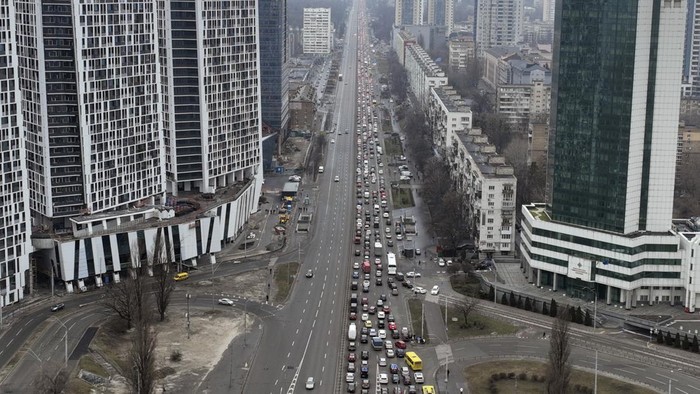 Traffic jams are seen as people leave the city of Kyiv, Ukraine, Thursday, Feb. 24, 2022. Russian President Vladimir Putin on Thursday announced a military operation in Ukraine and warned other countries that any attempt to interfere with the Russian action would lead to 
