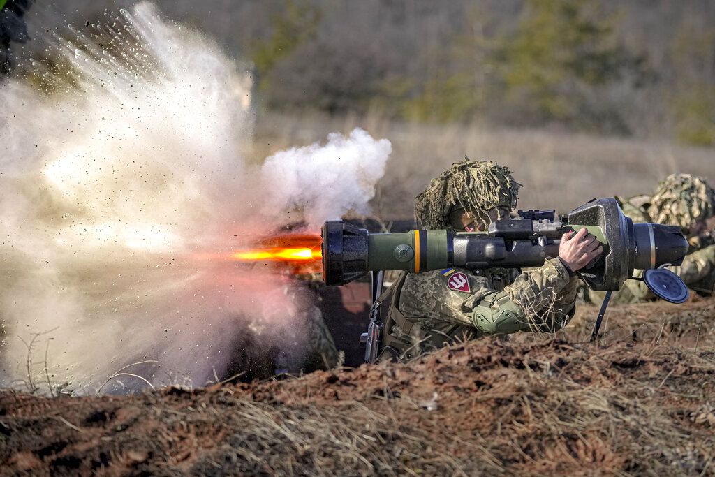 A Ukrainian serviceman fires an NLAW anti-tank weapon during an exercise in the Joint Forces Operation, in the Donetsk region, eastern Ukraine, Tuesday, Feb. 15, 2022. (AP Photo/Vadim Ghirda)