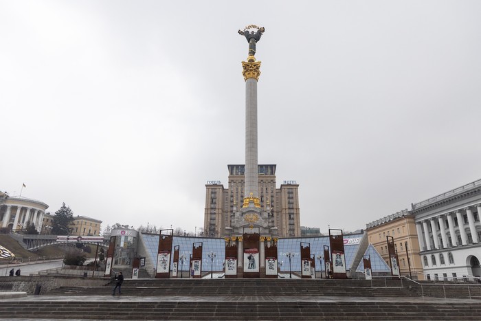 KRAMATORSK, UKRAINE - FEBRUARY 24: A woman waits to cross a street on February 24, 2022 in Kramatorsk, Ukraine. Overnight, Russia began a large-scale attack on Ukraine, with explosions reported in multiple cities and far outside the restive eastern regions held by Russian-backed rebels. (Photo by Anastasia Vlasova/Getty Images)
