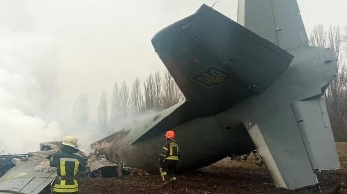 Rescuers work at the crash site of the Ukrainian Armed Forces' Antonov aircraft, which, according to the State Emergency Service, was shot down in Kyiv region, Ukraine, in this handout picture released February 24, 2022. Press service of the Ukrainian State Emergency Service/Handout via REUTERS ATTENTION EDITORS - THIS IMAGE HAS BEEN SUPPLIED BY A THIRD PARTY.