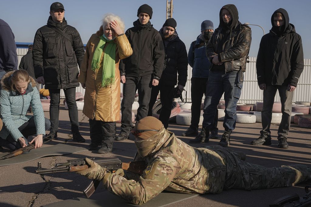 Valentyna Konstantynovska, 79 years-old, holds a weapon during basic combat training for civilians, organized by the Special Forces Unit Azov, of Ukraine's National Guard, in Mariupol, Donetsk region, eastern Ukraine, Sunday, Feb. 13, 2022. The United States is evacuating almost all of the staff from its embassy in Kyiv as Western intelligence officials warn that a Russian invasion of Ukraine is increasingly imminent. (AP Photo/Vadim Ghirda)