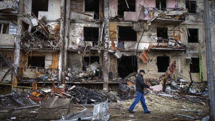View of a building damaged following a rocket attack the city of Kyiv, Ukraine, Friday, Feb. 25, 2022. (AP Photo/Emilio Morenatti)