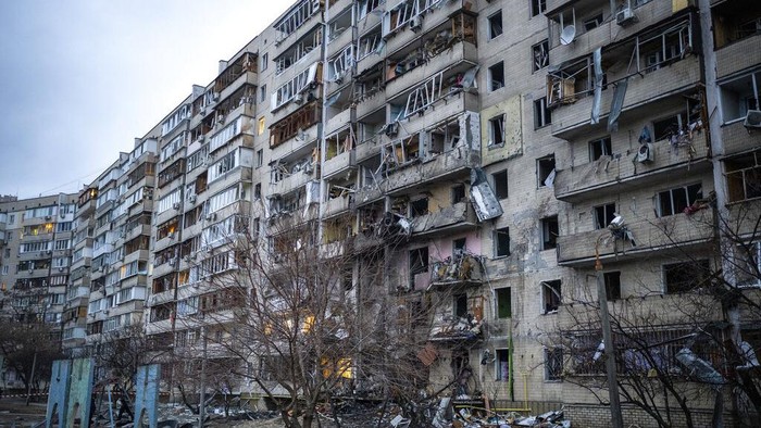 View of a building damaged following a rocket attack the city of Kyiv, Ukraine, Friday, Feb. 25, 2022. (AP Photo/Emilio Morenatti)