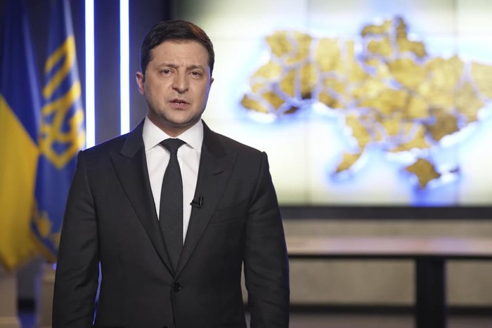 In this handout photo taken from video provided by the Ukrainian Presidential Press Office, Ukrainian President Volodymyr Zelenskyy addresses the nation in Kyiv, Ukraine, Thursday, Feb. 24, 2022. Zelenskyy declared martial law, saying Russia has targeted Ukraines military infrastructure. He urged Ukrainians to stay home and not to panic. (Ukrainian Presidential Press Office via AP)