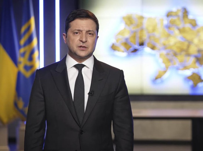 In this handout photo taken from video provided by the Ukrainian Presidential Press Office, Ukrainian President Volodymyr Zelenskyy addresses the nation in Kyiv, Ukraine, Thursday, Feb. 24, 2022. Zelenskyy declared martial law, saying Russia has targeted Ukraines military infrastructure. He urged Ukrainians to stay home and not to panic. (Ukrainian Presidential Press Office via AP)