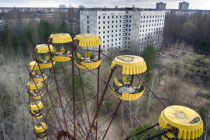FILE - An abandoned Ferris wheel stands in the park in the ghost town of Pripyat, Ukraine, close to the Chernobyl nuclear plant, on April 15, 2021. Among the most worrying developments on an already shocking day, as Russia invaded Ukraine on Thursday, was warfare at the Chernobyl nuclear plant, where radioactivity is still leaking from historys worst nuclear disaster 36 years ago.(AP Photo/Efrem Lukatsky, File)