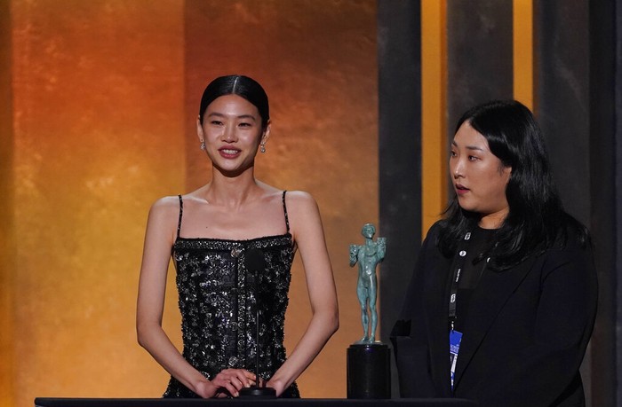 Jung Ho-yeon, left, accepts the award for outstanding performance by a female actor in a drama series for 