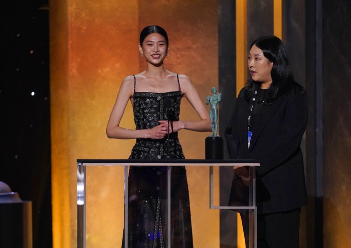 Jung Ho-yeon, left, accepts the award for outstanding performance by a female actor in a drama series for 