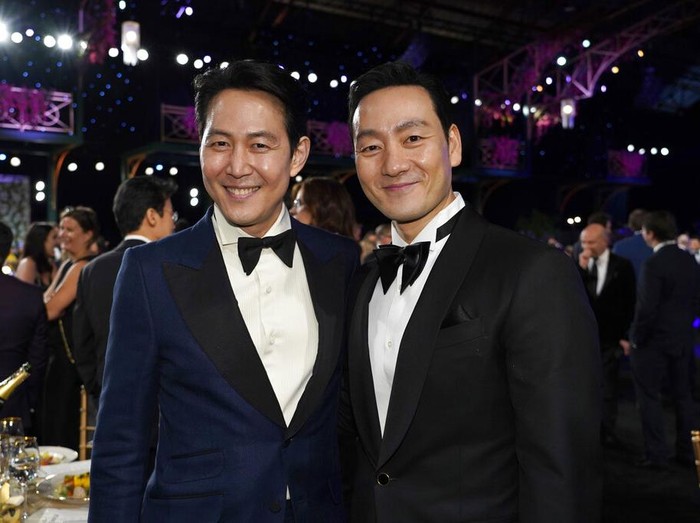 Lee Jung-jae, left, and Park Hae-soo attend the 28th annual Screen Actors Guild Awards at the Barker Hangar on Sunday, Feb. 27, 2022, in Santa Monica, Calif. (AP Photo/Chris Pizzello)