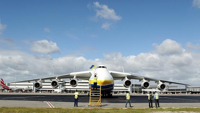 PERTH, AUSTRALIA - MAY 15:  A ground staff member signals to pilots after the arrival of the Antonov AN-225 Mriya at Perth International airport on May 15, 2016 in Perth, Australia. The Ukrainian cargo plane is 84 metres long and has a wingspan of 88.4 metres and is in Perth to  (Photo by Paul Kane/Getty Images)