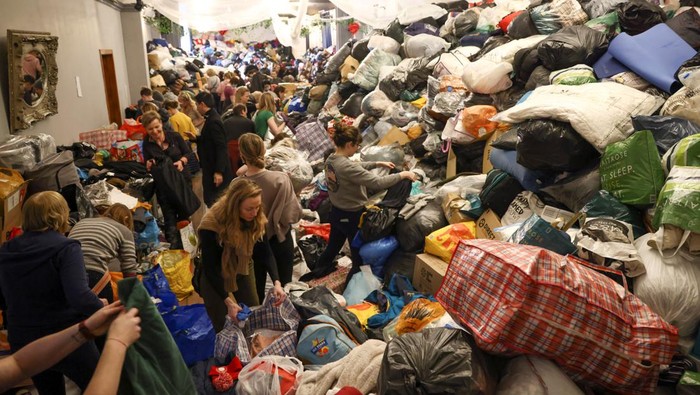 Volunteers sort through donations at the White Eagle Club, ahead of their convoy leaving to deliver aid to those fleeing the Russian invasion in Ukraine, in south London, Britain, February 28, 2022. REUTERS/Henry Nicholls
