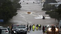 Diketahui, cuaca ekstrem yang menyebabkan kawasan Australia diguyur hujan lebat menyebabkan sejumlah wilayah di Negeri Kangguru terendam banjir. (AP Photo/Jason OBrien).  